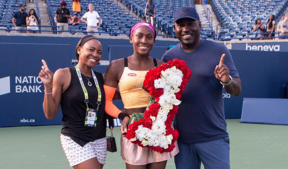 Coco Gauff with her parents Candi Gauff and Corey Gauff Credit: PA Images