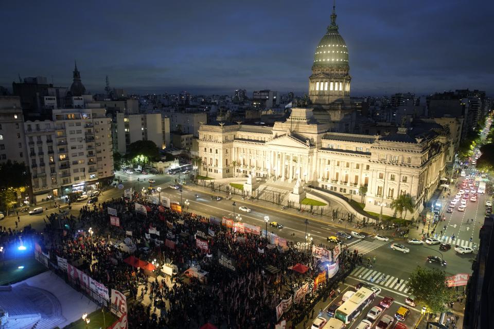 Anti-government protesters gather outside Congress where lawmakers debate a bill promoted by President Javier Milei that includes a broad range of economic, administrative, criminal, and environmental reforms in Buenos Aires, Argentina, Monday, April 29, 2024. (AP Photo/Natacha Pisarenko)
