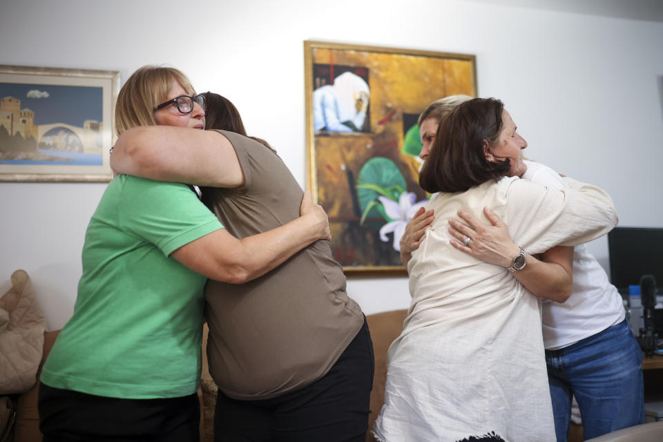 Members of the association Mothers of Srebrenica react after the United Nations General Assembly adopted a resolution declaring July 11 the International Day of Reflection and Commemoration of the 1995 genocide in Srebrenica, in Potocari, Bosnia, Thursday, May 23, 2024. (AP Photo/Armin Durgut)