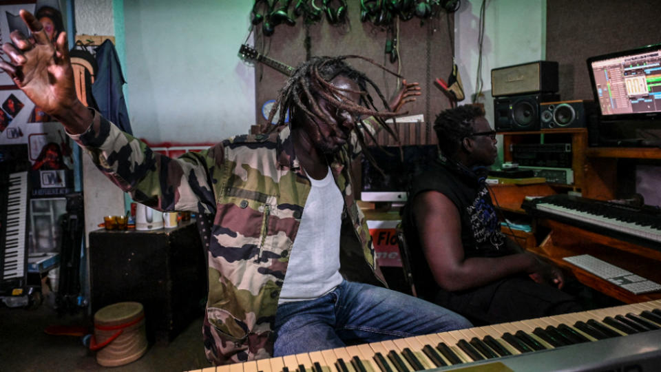 Niger's reggae artist Black Mailer gestures in a music studio during the recording of an album in support of the Niger army in Niamey.