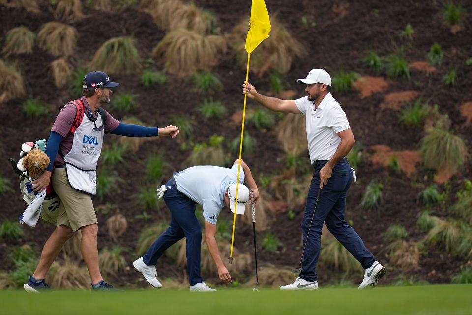 Jason Day removes the flag stick for Collin Morikawa, center, on the fourth green Friday at Austin Country Club. Day, the 2015 PGA Championship winner, has been trying to rediscover his old successes.