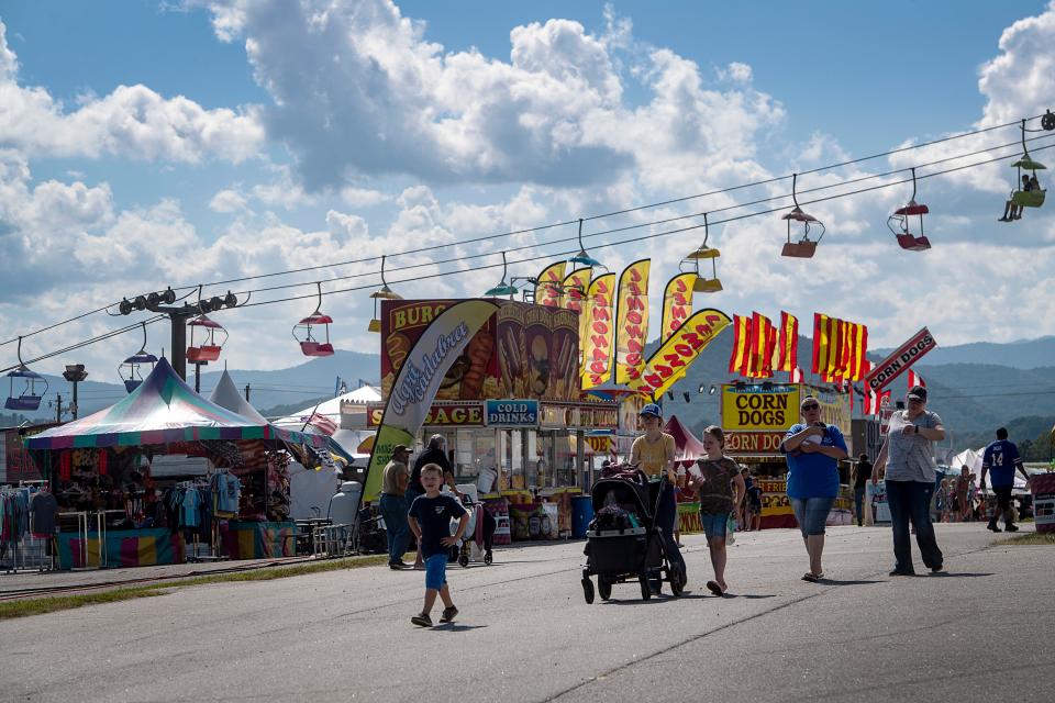 People take in the sights on the opening day of the NC Mountain State Fair, September 8, 2023.