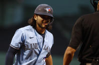 Toronto Blue Jays' Bo Bichette looks back at the umpire after being called out on strikes during the first inning of a baseball game Tuesday, April 20, 2021, at Fenway Park in Boston. (AP Photo/Winslow Townson)