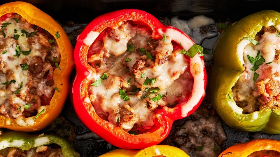 colorful stuffed peppers with ground beef and tomato rice