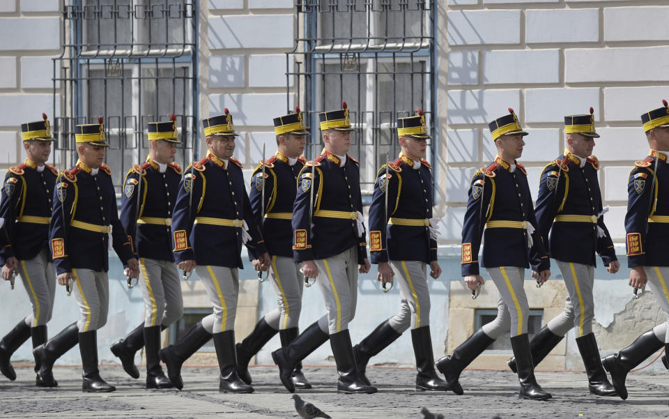 Soldiers march during an EU summit in Sibiu, Romania, Thursday, May 9, 2019. European Union leaders on Thursday start to set out a course for increased political cooperation in the wake of the impending departure of the United Kingdom from the bloc. (AP Photo/Andreea Alexandru)