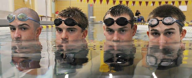 Bloomington North coach Max Irwin (right) was in the pool last time the Cougars sent all three relays to state in 2012, joining forces with Jack Spore, left, Matt Nephew and Jack Ryan.