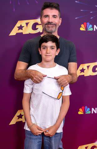 <p>Amanda Edwards/Getty</p> Simon Cowell and his son Eric.