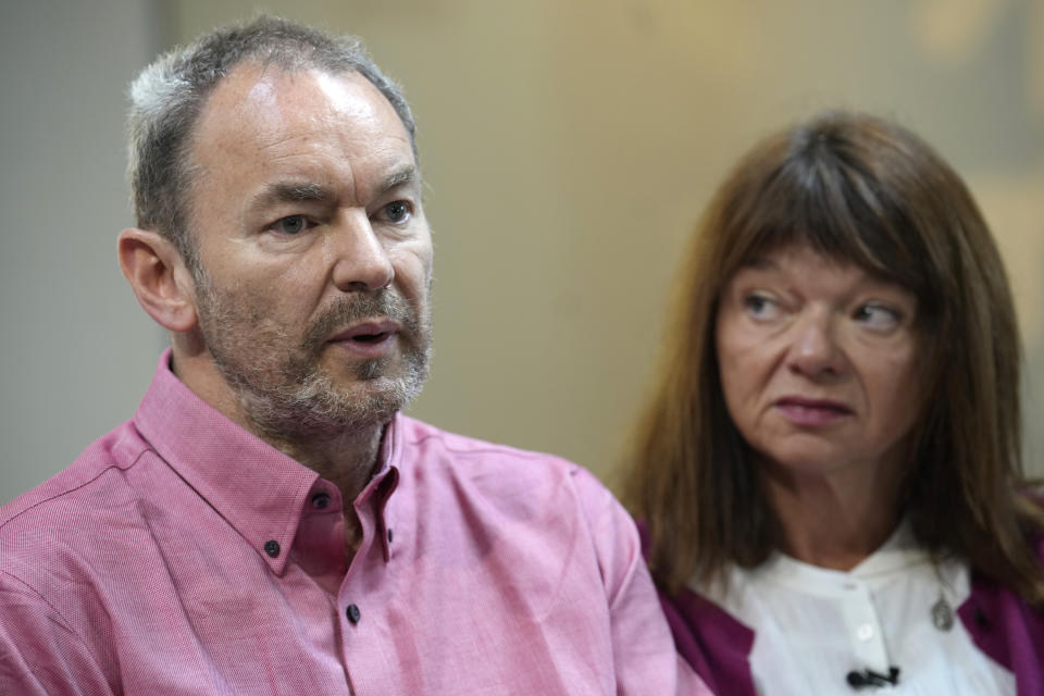 Simon Glass, left, and his wife, Sally Glass, talk about the $19 million settlement from state and local law enforcement agencies for the killing of the couple's 22-year-old son, Christian, in June 2022, while he suffered a mental health crisis on Tuesday, May 23, 2023, during a news interview in the offices of the couple's lawyers in Denver. As part of the settlement, training for law officers will change as well. (AP Photo/David Zalubowski)