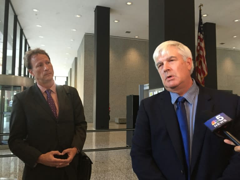 Attorney William Zieske (left) and his client Robert Fletcher (right) speak to reporters at the US federal courthouse in Chicago on August 23, 2016, after losing their lawsuit against artist Peter Doig