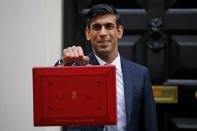 Britain's Chancellor of the Exchequer Rishi Sunak poses for pictures with the Budget Box as he leaves 11 Downing Street on March 11, 2020 ahead of the announcement of Britain's first post-Brexit budget. - Britain unveils its first post-Brexit budget on on March 11, with all eyes on emergency government measures to ease the economic pain from the coronavirus outbreak. (Photo by Tolga AKMEN / AFP) (Photo by TOLGA AKMEN/AFP via Getty Images)