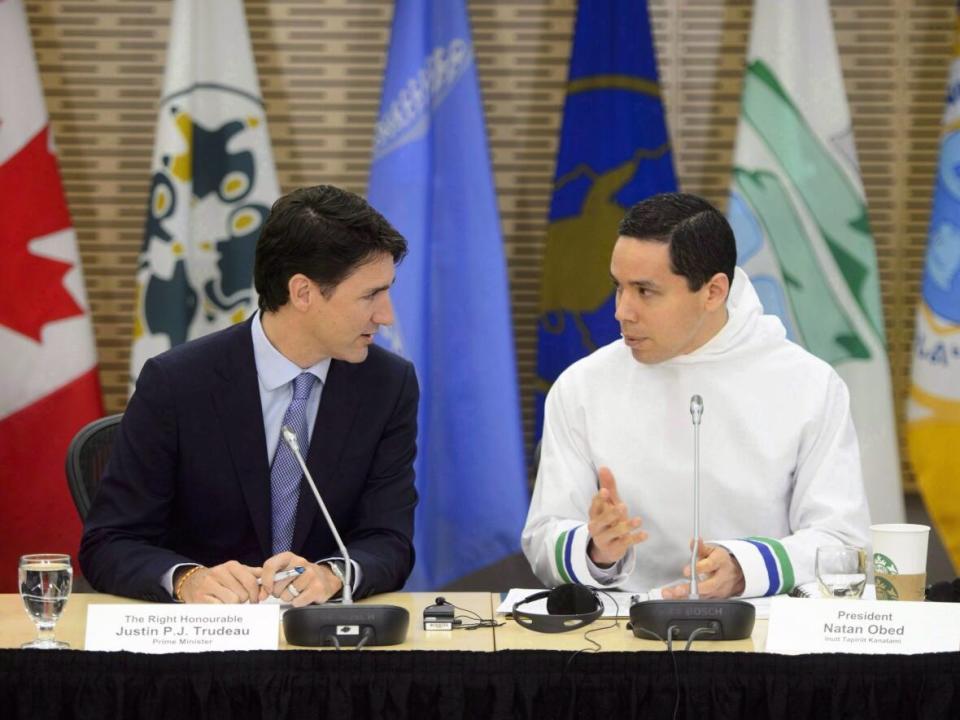 Prime Minister Justin Trudeau, left, and Natan Obed, president of Inuit Tapiriit Kanatami, speak in March. Obed sent Trudeau a letter this month outlining ITK's stance on the NunatuKavut community council. (Sean Kilpatrick/The Canadian Press - image credit)