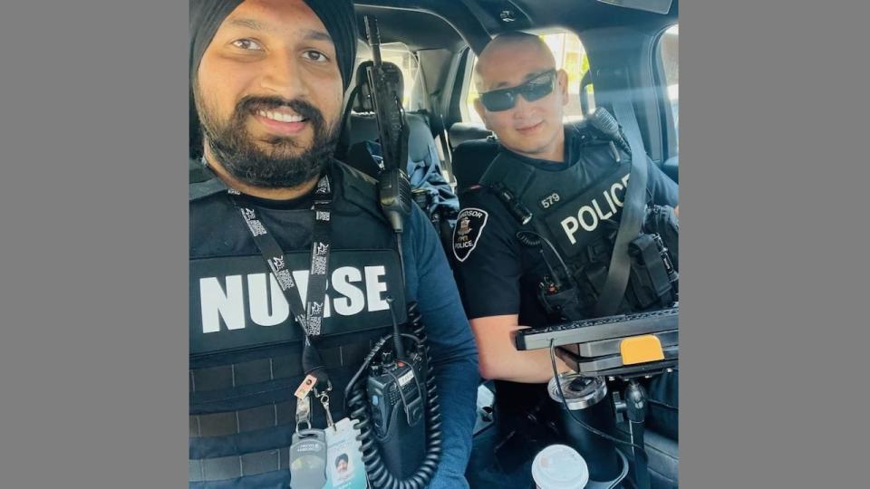 Kuljeet Kalsi (left) a Windsor nurse participating in the Nurse-Police Team program and Const. Phong Le (right) of the Windsor Police Service.