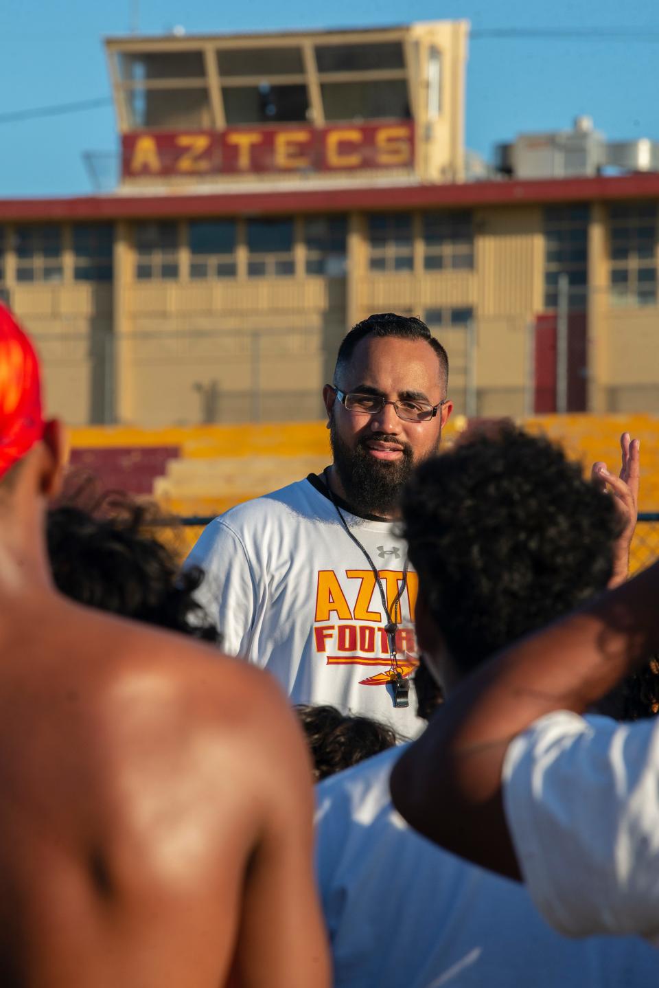 Barstow head coach Clayton Leleimene talks to his team during a recent summer football practice at the school. Barstow begins the season on the road against Hesperia on Aug. 18.