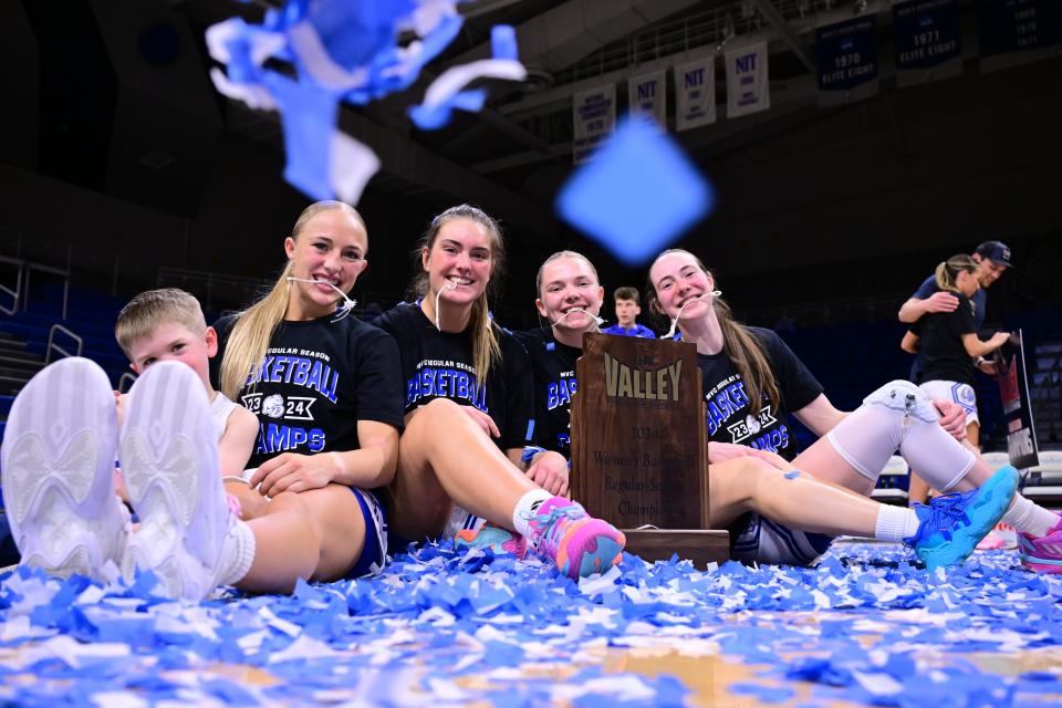Drake women's basketball players celebrate Saturday, March 2, 2024, at the Knapp Center after clinching at least a share of the Missouri Valley Conference championship.