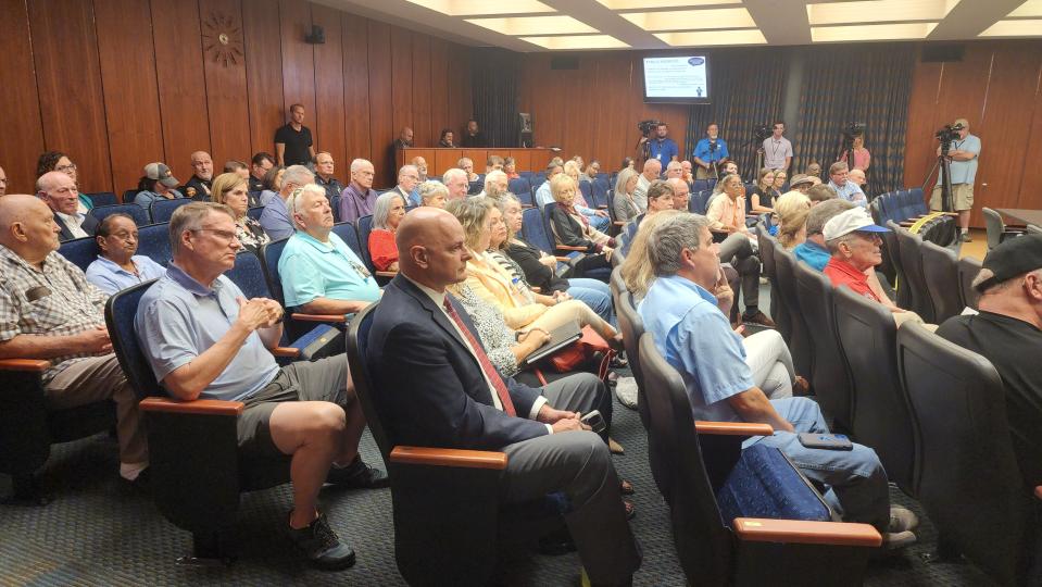 Former Amarillo city manager Jared Miller sits in the gallery of city hall during a special meeting regarding his separation from the city Wednesday in downtown Amarillo.