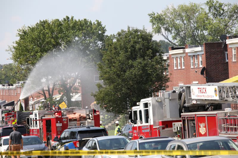 Fire trucks are seen at the scene of an explosion in a residential area of Baltimore