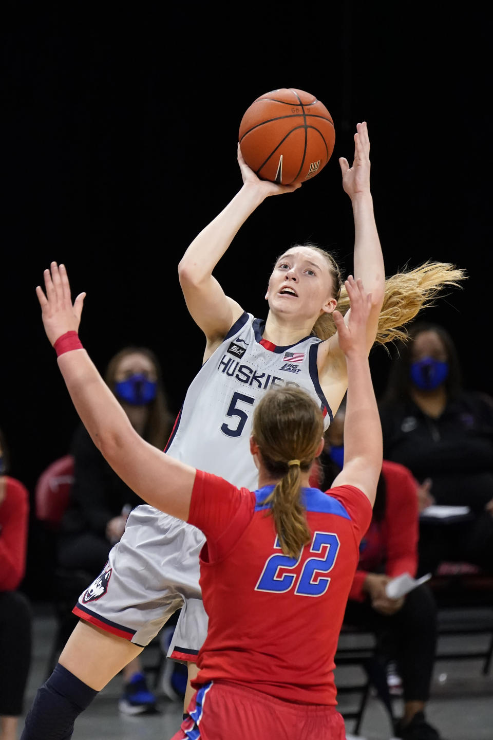 Connecticut's Paige Bueckers (5) shoots over DePaul's Jorie Allen during the first half of an NCAA college basketball game Sunday, Jan. 31, 2021, in Chicago. (AP Photo/Charles Rex Arbogast)