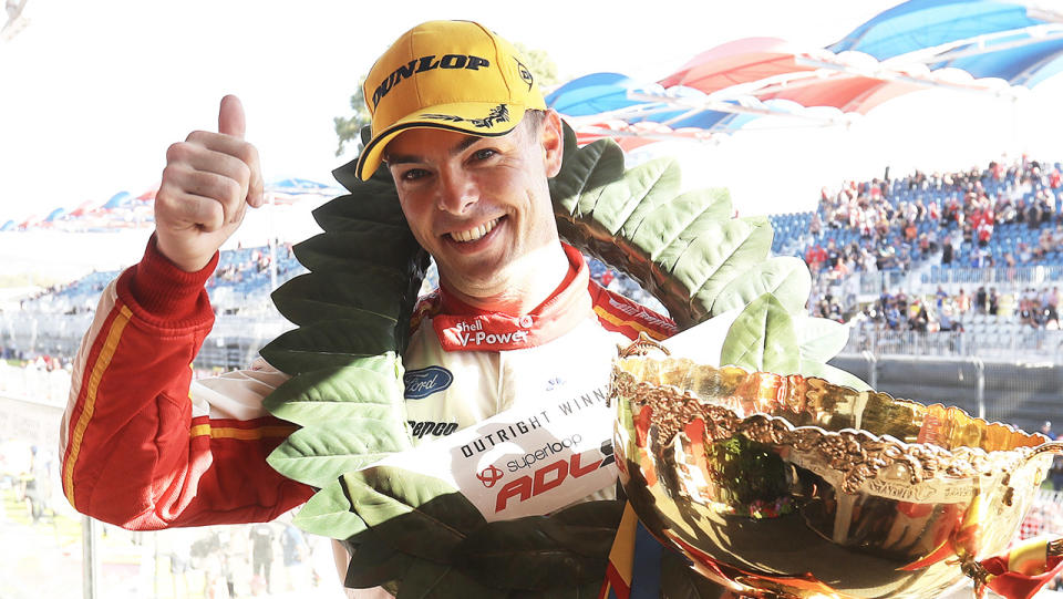 Scott McLaughlin smiles and celebrates his win.