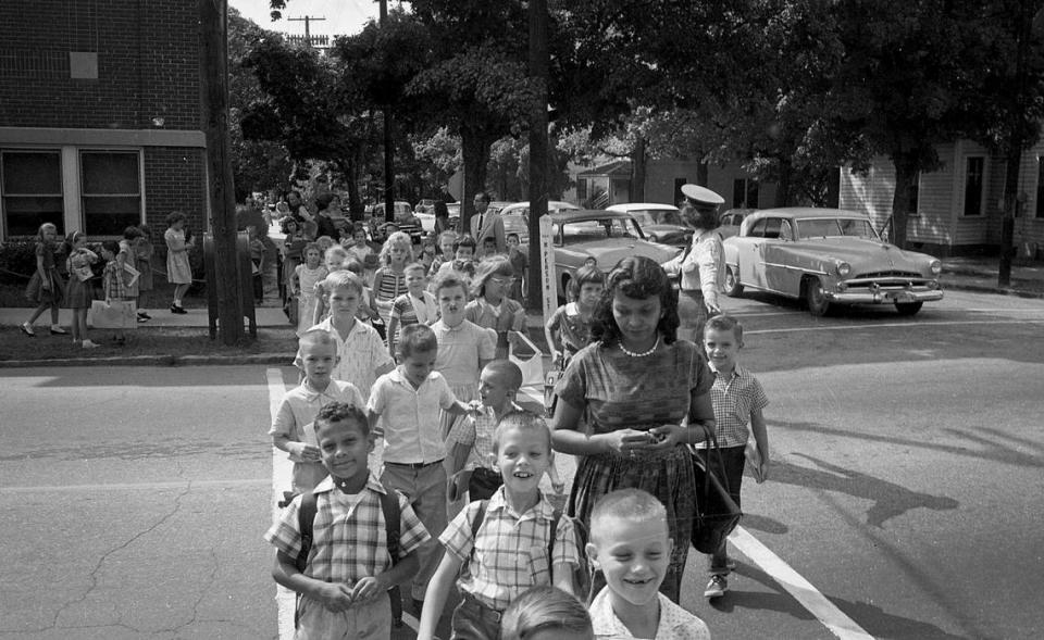 William Campbell, Jr.,the first Black child admitted to an all white school in Raleigh is seen being walked home after school by his mother, September 9,1960.