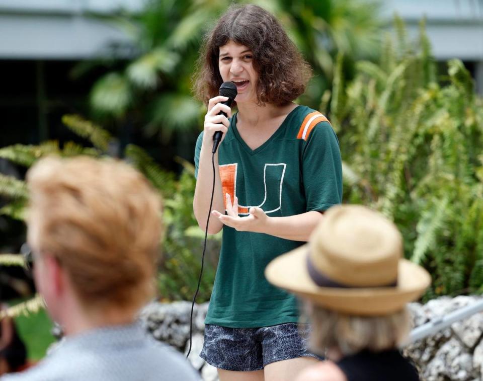 University of Miami student, Juniper Our, 20, asks questions of a UM faculty panel gathered for a teach-in to raise awareness about two law proposals backed by Florida Governor Ron DeSantis that would affect higher ed, House Bill 999 and Senate Bill 266. Students and faculty gathered at Rock Plaza on campus in Coral Gables on Tuesday, April 25, 2023.