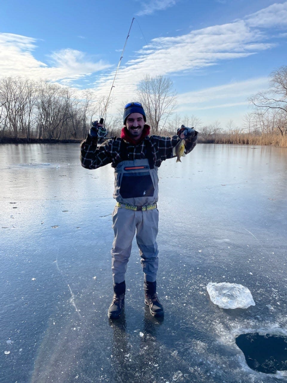 Rich Thomas of Howell with a sunny he caught ice fishing in Wall on Jan. 23, 2022