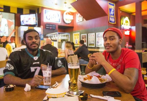Shakir Leatherbury and Alex Barnett, of Wilmington, hang out at Buffalo Wild Wings in Newark. A new location opened Dec. 18, 2023, in Milford.