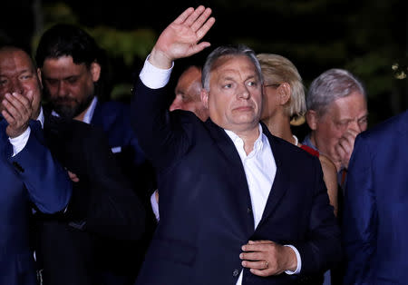 Hungarian Prime Minister Viktor Orban waves after addressing supporters, following the preliminary results of the European Parliament election in Budapest, Hungary, May 26, 2019. REUTERS/Bernadett Szabo