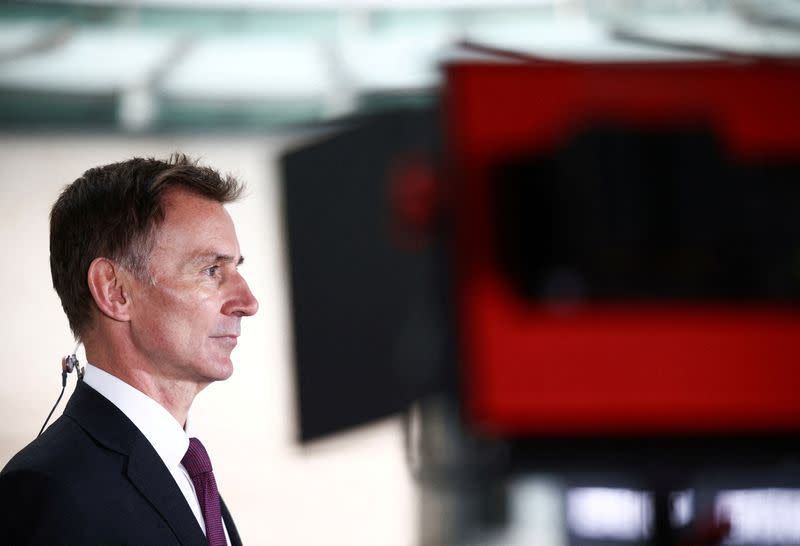 FILE PHOTO: British Chancellor of the Exchequer Jeremy Hunt talks to a television crew outside the BBC headquarters in London