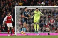 Britain Soccer Football - Arsenal v Middlesbrough - Premier League - Emirates Stadium - 22/10/16 Middlesbrough's Victor Valdes heads clear of Daniel Ayala and Arsenal's Mesut Ozil Action Images via Reuters / John Sibley Livepic