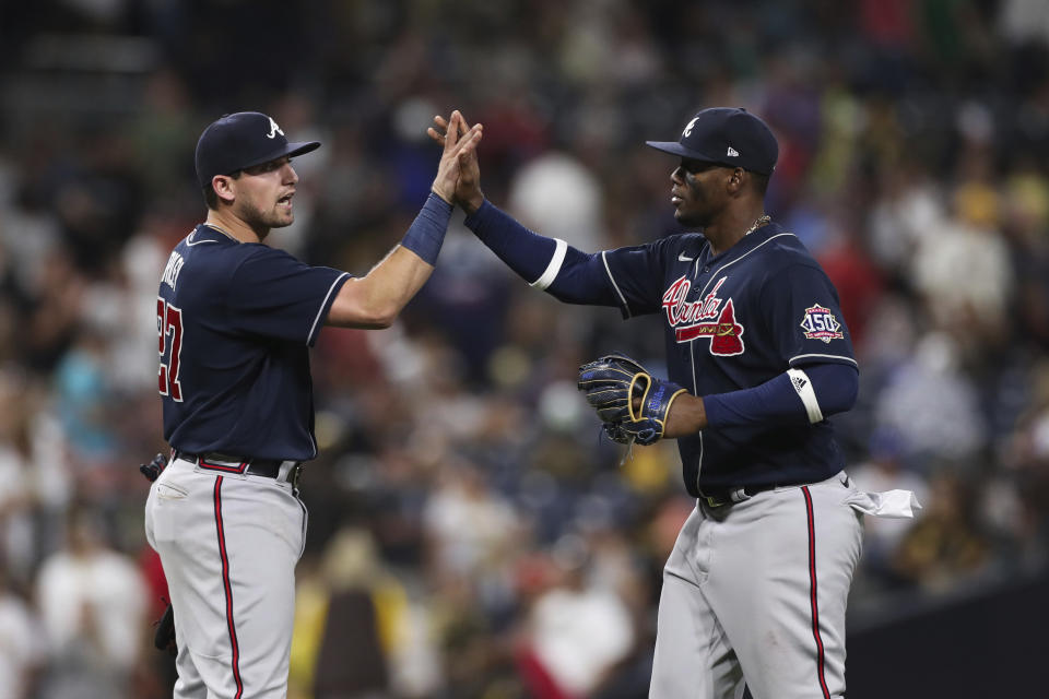 Atlanta Braves' Jorge Soler, right, celebrates with Austin Riley after they defeated the San Diego Padres in a baseball game Saturday, Sept. 25, 2021, in San Diego. (AP Photo/Derrick Tuskan)