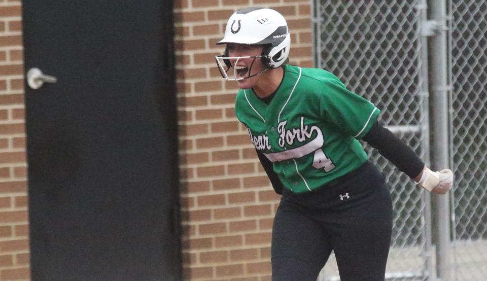 Clear Fork's Macy Ousley celebrates the first of her two home runs in a 9-3 win over Shelby on Wednesday night.