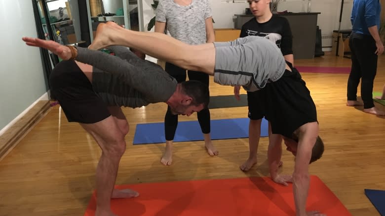 Taking yoga to new heights with acro yoga