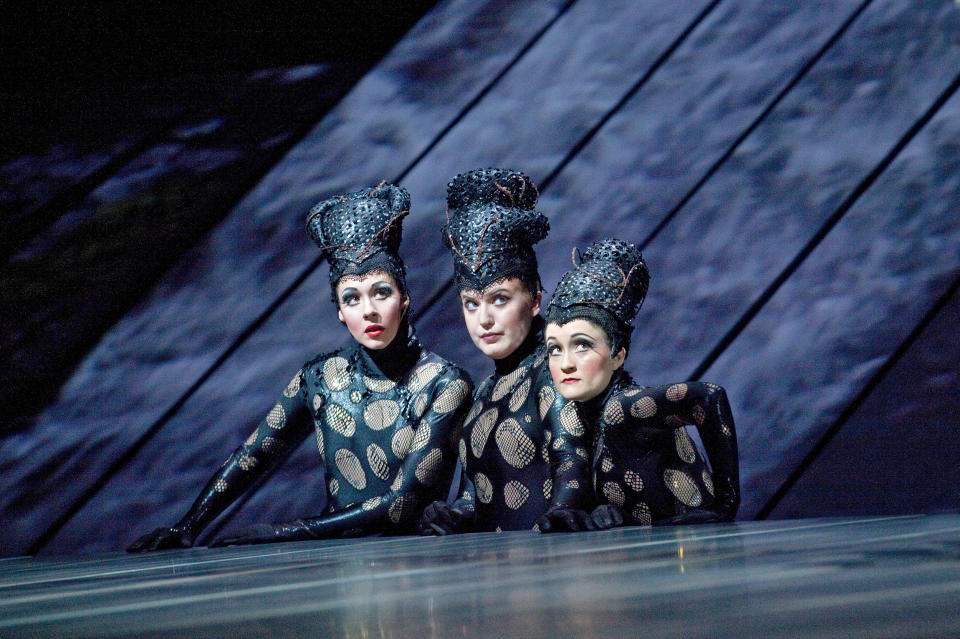 This Jan. 19, 2012 photo provided by the Metropolitan Opera shows, the Rhinemaidens, from left, Tamara Mumford as Flosshilde, Jennifer Johnson Cano as Wellgunde, and Erin Morley as Woglinde in Wagner's, "Gotterdammerung" during a dress rehearsal at the Metropolitan Opera in New York. On May 12 the Met concludes the last of three complete presentations of Robert Lepage's production of the four-opera Ring Cycle, which includes Das Rheingold; Die Walkure; Siegfried and Gotterdammerung. (AP Photo/The Metropolitan Opera, Ken Howard)