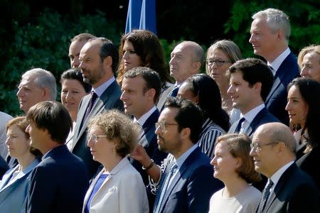 French President Emmanuel Macron (C), Prime Minister Edouard Philippe and ministers pose for a family photo in the gardens of the Elysee Palace before the weekly cabinet meeting in Paris, France, June 22, 2017. REUTERS/Charles Platiau