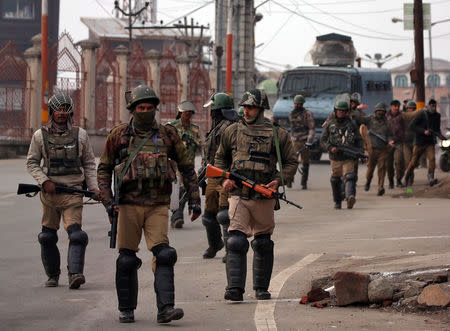 Indian Central Reserve Police Force (CRPF) personnel patrol a street in downtown Srinagar February 23, 2019. REUTERS/Danish Ismail