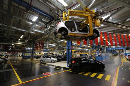 Ford Fiestas are seen on the Ford assembly line in Cologne September 12, 2013. REUTERS/Wolfgang Rattay