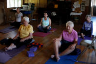 <p>Immigrant Rosa Sabido, 53, (C) takes part in a yoga class in the United Methodist Church in which she lives while facing deportation in Mancos, Colo., July 19, 2017. (Photo: Lucy Nicholson/Reuters) </p>