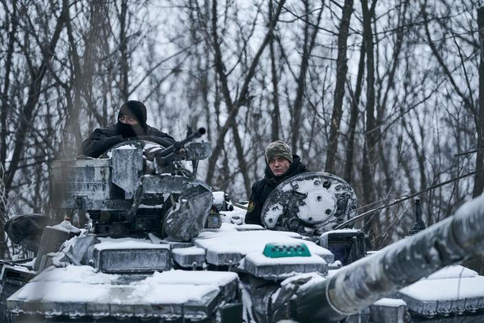 A Ukrainian tank rides to its position in the frontline in Bakhmut, Donetsk region, Ukraine, on Feb. 12, 2023.