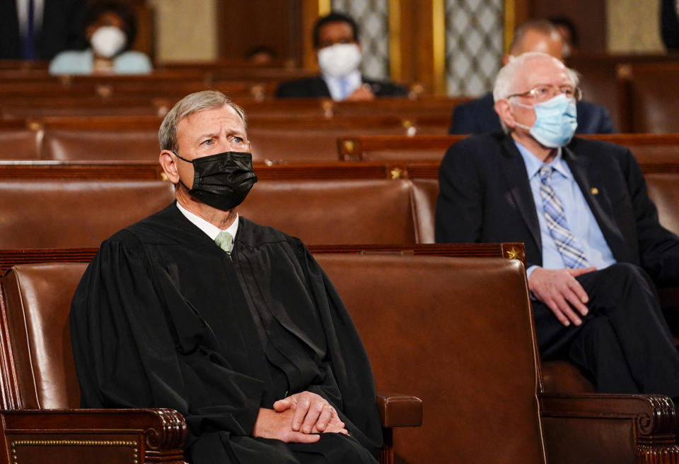 Chief Justice John Roberts and Sen. Bernie Sanders.