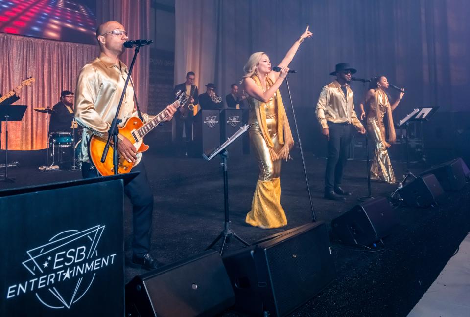 Members of The Elite Show Band pose at the Modernism Week opening night party on Feb. 15, 2024, in Palm Springs, Calif.