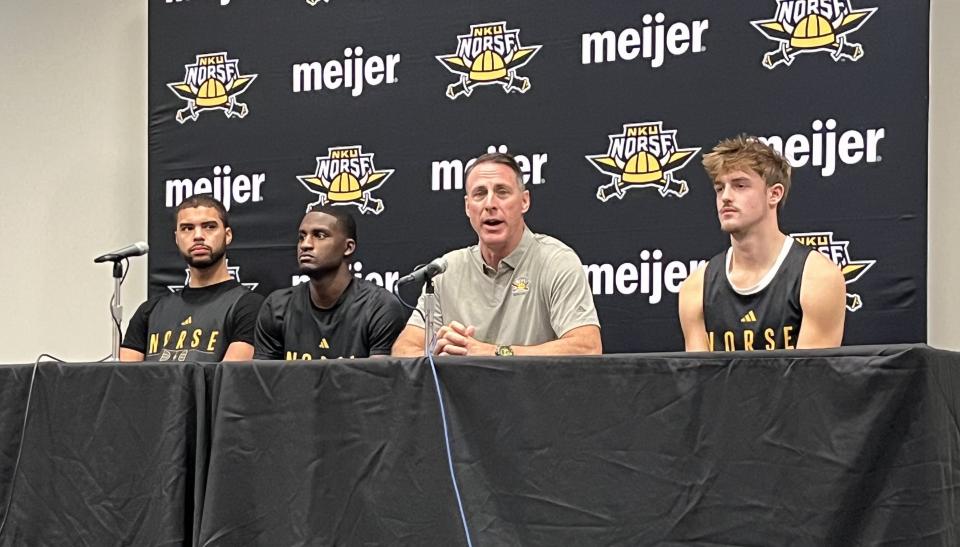 NKU head coach Darrin Horn with veteran players, from left, Trey Robinson, Marques Warrick and Sam Vinson as Northern Kentucky University men's basketball team had preseason practice Oct. 26, 2023, at Truist Arena.