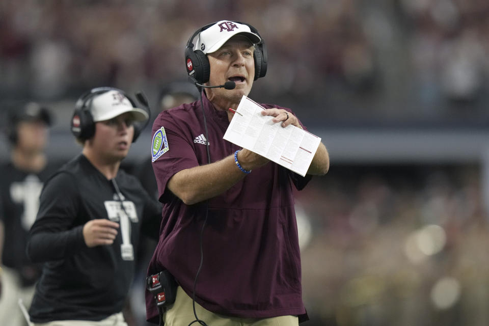 Texas A&M head coach Jimbo Fisher calls a time out during the first half of an NCAA college football game against Arkansas, Saturday, Sept. 30, 2023, in Arlington, Texas. (AP Photo/LM Otero)
