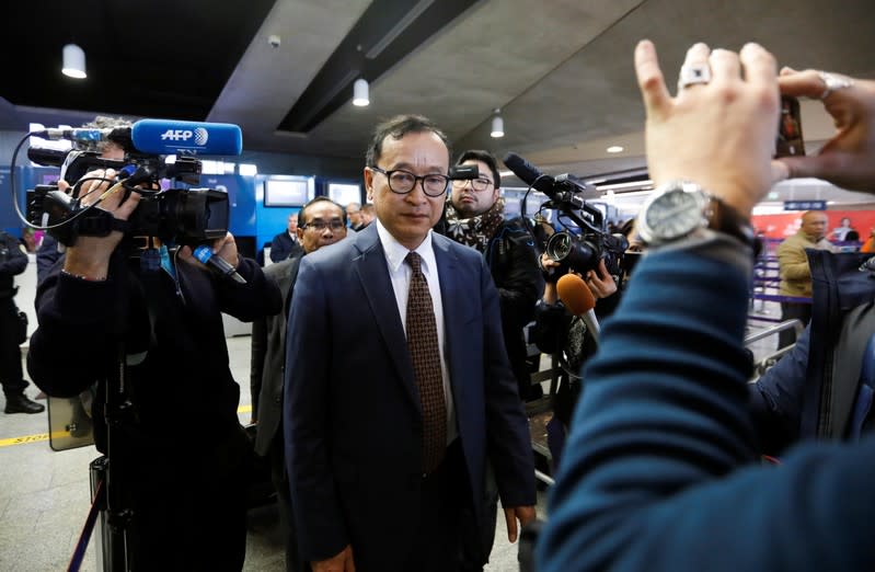 Cambodia's self-exiled opposition party founder Sam Rainsy, who has vowed to return to his home country, leaves after being prevented from checking-in for a flight from Paris to Bangkok at Roissy Airport in Paris