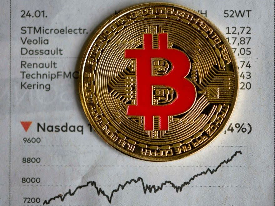 The price of bitcoin hit a new all-time high on 30 November (AFP via Getty Images)