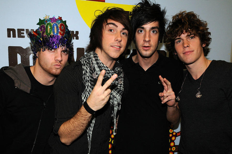 All Time Low members Alex Gaskarth, Jack Barakat, Zack Merrick, and Rian Dawson pose at the 2009 MTV New Year's Eve program