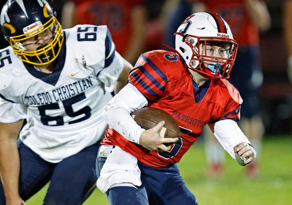 Britton Deerfield's Keegan Bush carries the ball during Friday's game against Toledo Christian.