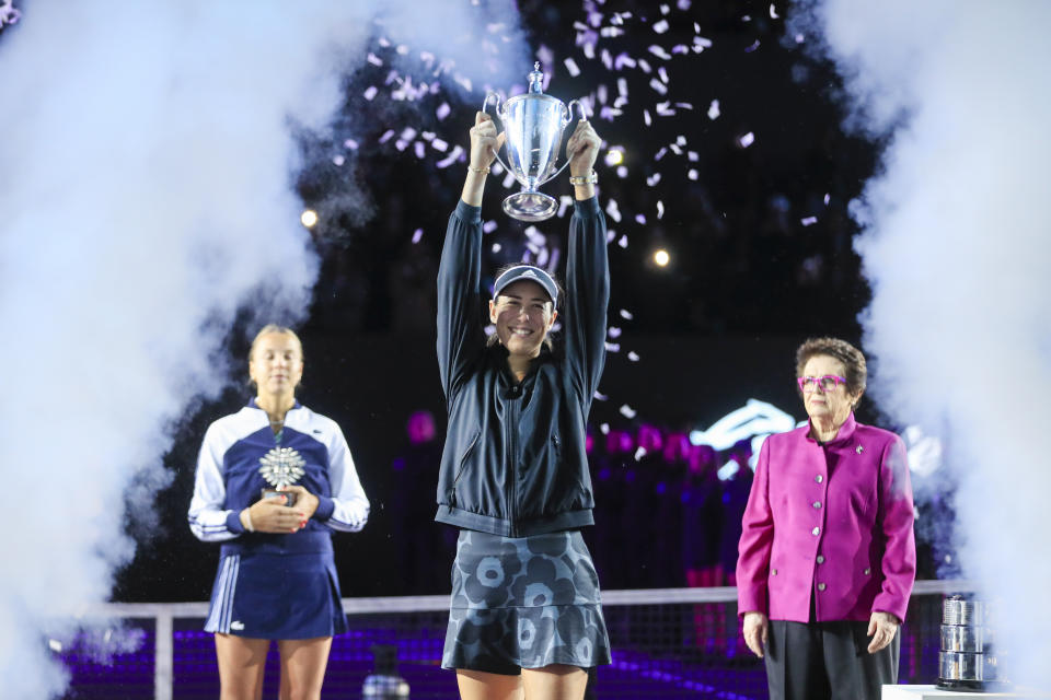 Garbiñe Muguruza, of Spain, holds the trophy during an awarding ceremony after defeating Anett Kontaveit, of Estonia, at the final match of the WTA Finals tennis tournament in Guadalajara, Mexico, Wednesday, Nov. 17, 2021. (AP Photo/Refugio Ruiz)