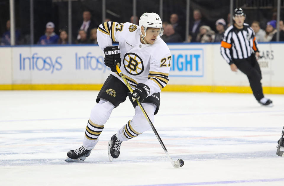 Nov 25, 2023; New York, New York, USA; Boston Bruins defenseman Hampus Lindholm (27) looks to pass against the <a class="link " href="https://sports.yahoo.com/nhl/teams/ny-rangers/" data-i13n="sec:content-canvas;subsec:anchor_text;elm:context_link" data-ylk="slk:New York Rangers;sec:content-canvas;subsec:anchor_text;elm:context_link;itc:0">New York Rangers</a> during the third period at Madison Square Garden. Mandatory Credit: Danny Wild-USA TODAY Sports