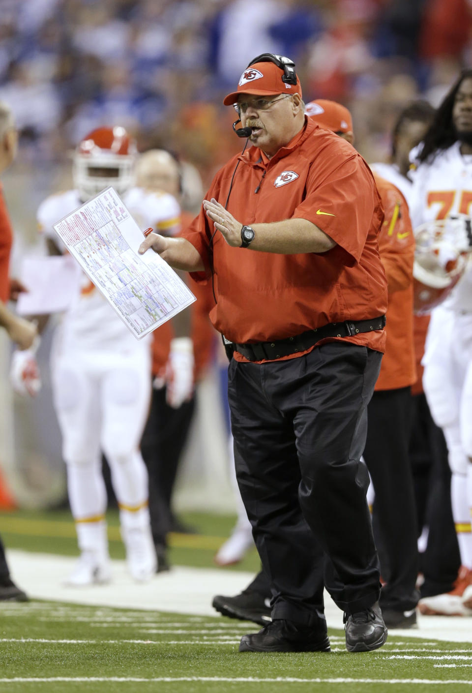 Kansas City Chiefs head coach Andy Reid directs play from the sideline against the Indianapolis Colts during the first half of an NFL wild-card playoff football game Saturday, Jan. 4, 2014, in Indianapolis. (AP Photo/Michael Conroy)