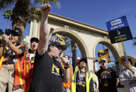 SAG-AFTRA chief negotiator Duncan Crabtree-Ireland, left, rallies striking actors in outside Paramount Pictures studio, Friday, Nov. 3, 2023, in Los Angeles. (AP Photo/Chris Pizzello)